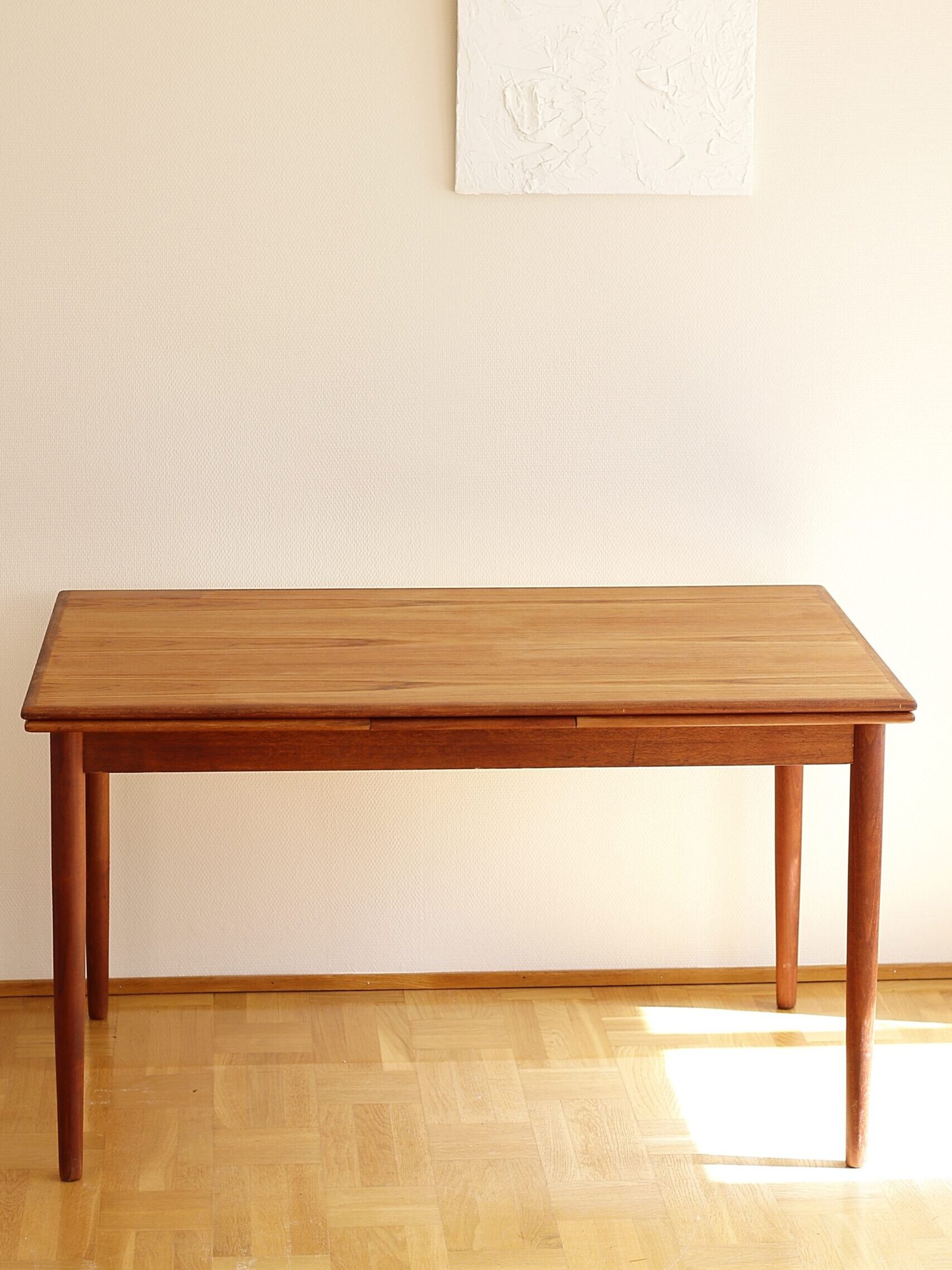 Danish extendable teak dining table. The table originates from 1960s EN Møbler, Denmark